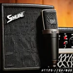 기타 녹음 장비 추천 - A close-up studio shot of a professional dynamic microphone (Shure SM57) positioned right in front o...